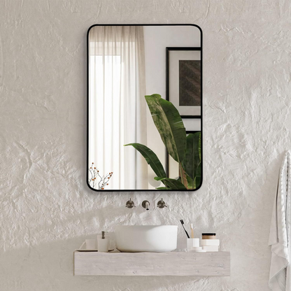 Rectangular metal frame wall mirror for bathroom, bedroom, or entryway decor, with sleek silver finish and reflective glass surface.