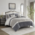 Start2Finish 5-piece textured jacquard stripe comforter set with matching throw pillows on a bed, showcasing elegant bedding design.