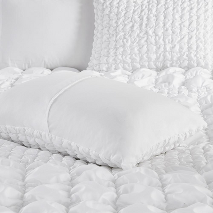 Start2Finish Evelyn 3-piece stripe ruched comforter set in white with matching pillow shams on a bed.