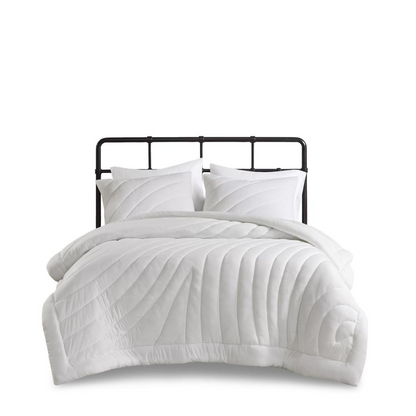 Start2Finish Poly Jersey Puffy Comforter Set in soft, quilted fabric with a cozy, plush appearance on a bed.