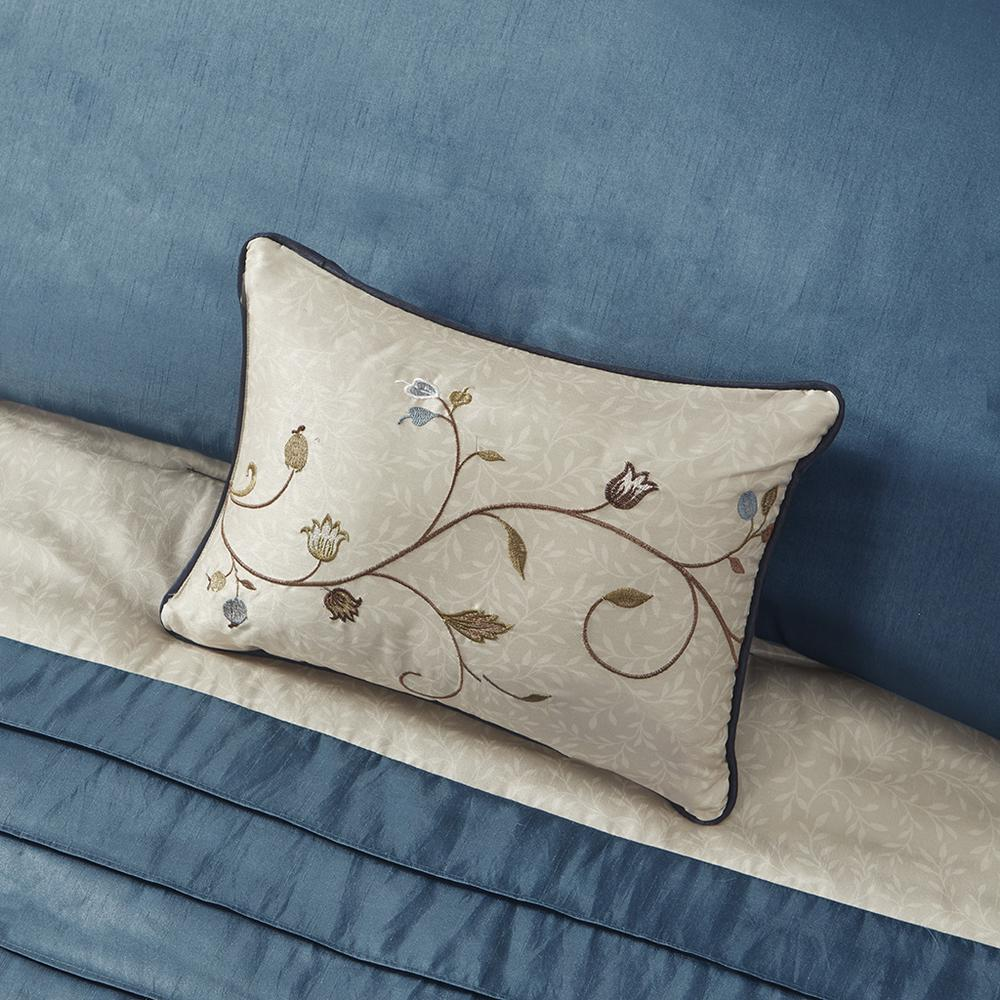 Start2Finish Serene Embroidered 7-Piece Comforter Set in navy with decorative pillows on a bed.