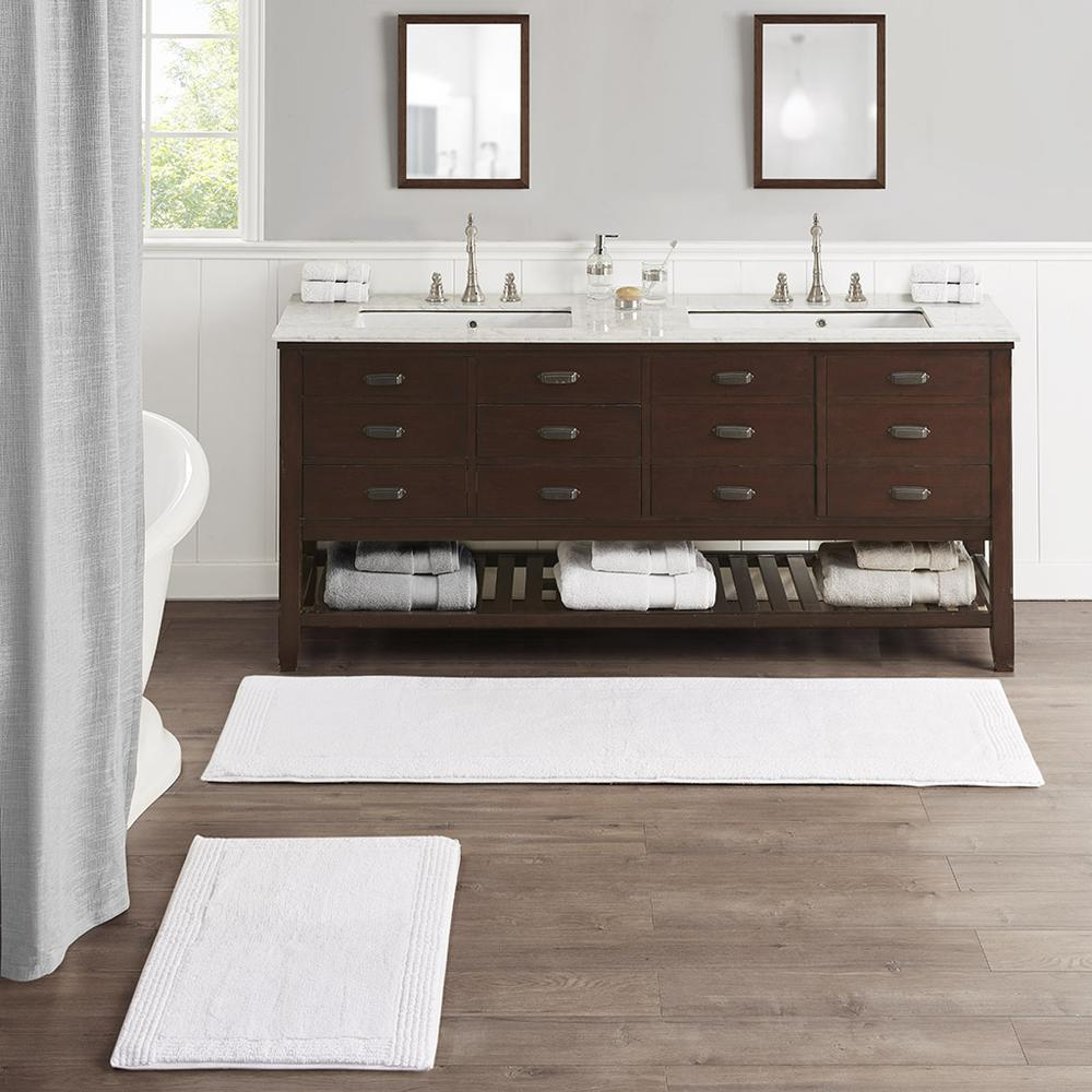 Reversible cotton bath rug with plush tufted design, 3000 GSM, from Start2Finish, showing soft, textured surface and vibrant pattern.