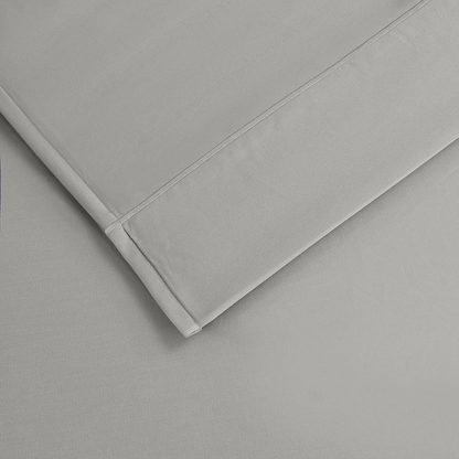 Start2Finish Pima Cotton Sheet Set with smooth, white bed linens and neatly folded sheets on a cozy bed.