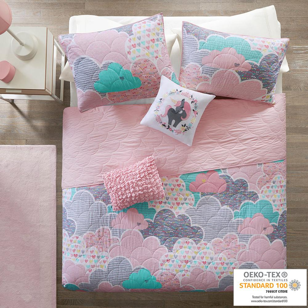 Reversible cotton quilt set with matching throw pillows, featuring a soft, patterned design in neutral tones.