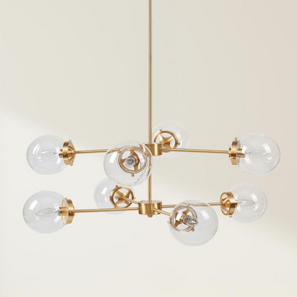 Start2Finish 8-light metal chandelier with globe bulbs hanging from a modern ceiling fixture in a stylish interior setting