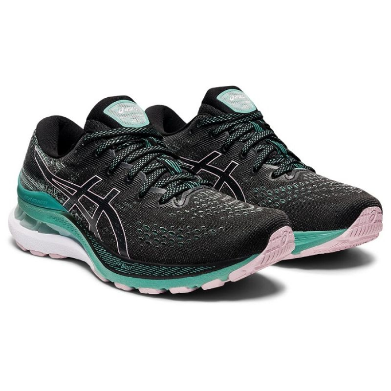 Asics Gel Kayano 28 W running shoes in gray and pink with cushioned soles and supportive design, shown from the side.