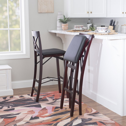 Start2Finish Triena 30-inch X-back folding bar stool with wooden seat and metal frame, showcasing its compact, stylish design.