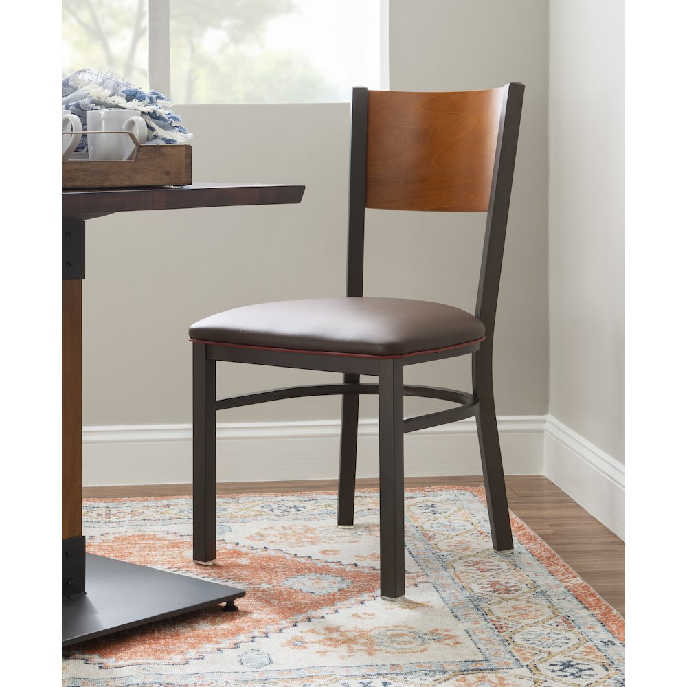 Pair of brown Elmer side chairs by Start2Finish, featuring modern wooden design and cushioned seats for dining or casual use.