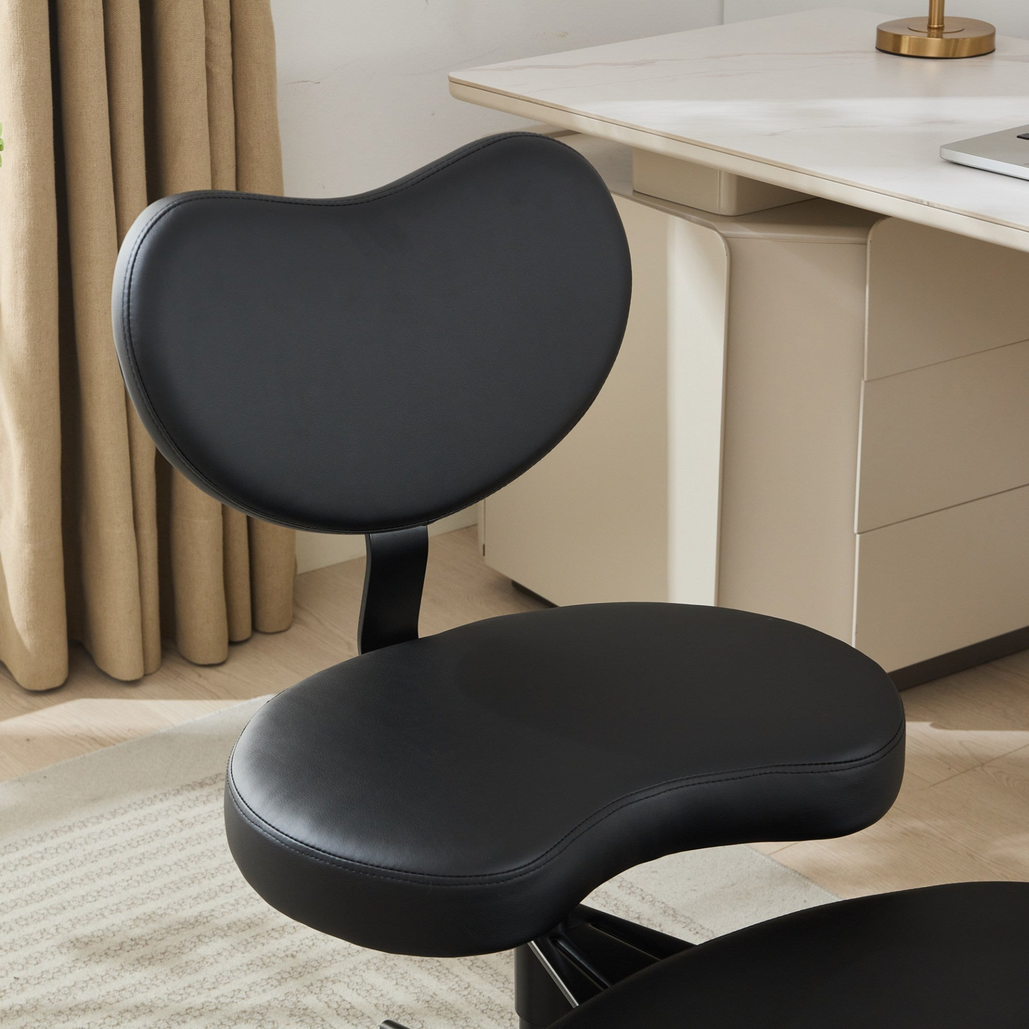 Black PU leather office chair by Start2Finish with USB port, power access, and swivel function for home or vanity desk use.