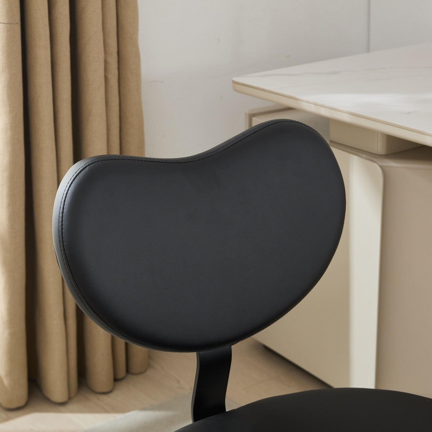 Black PU leather office chair by Start2Finish with USB port, power access, swivel function, ideal for home office or vanity desk.