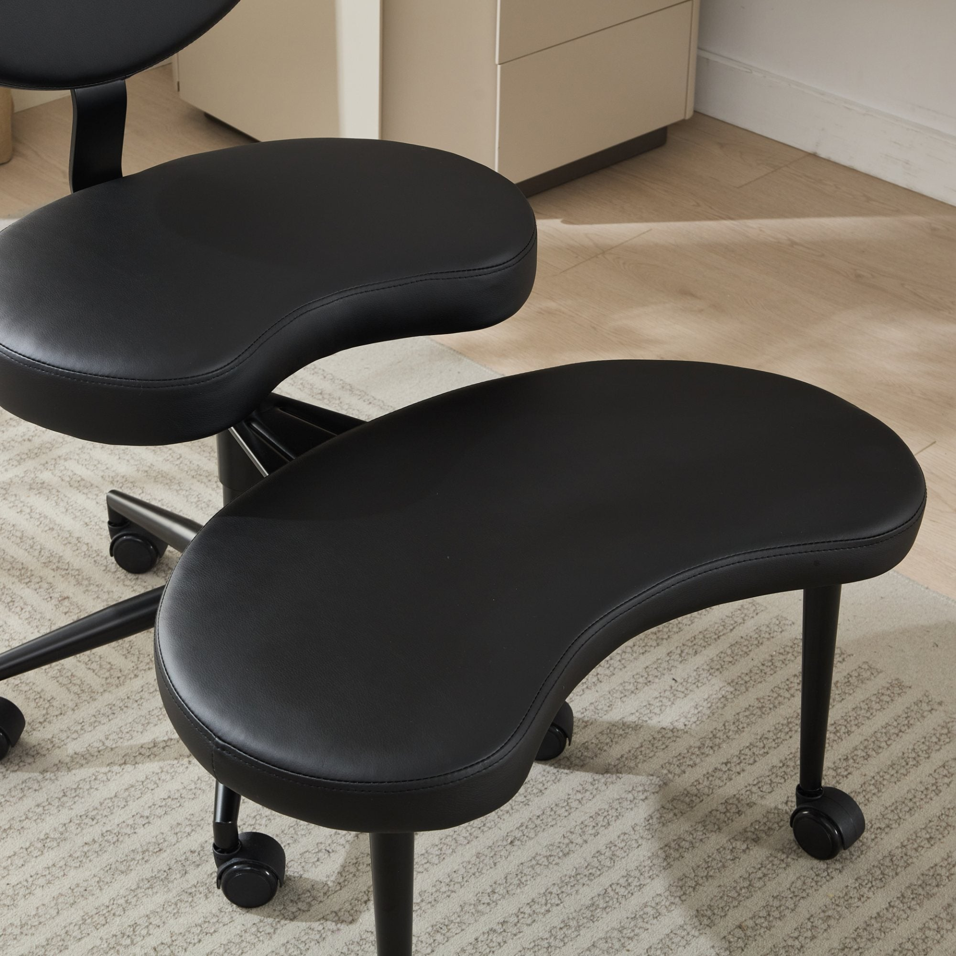 Black PU leather office chair with USB port, power access, and swivel function, suitable for home office or vanity desk.