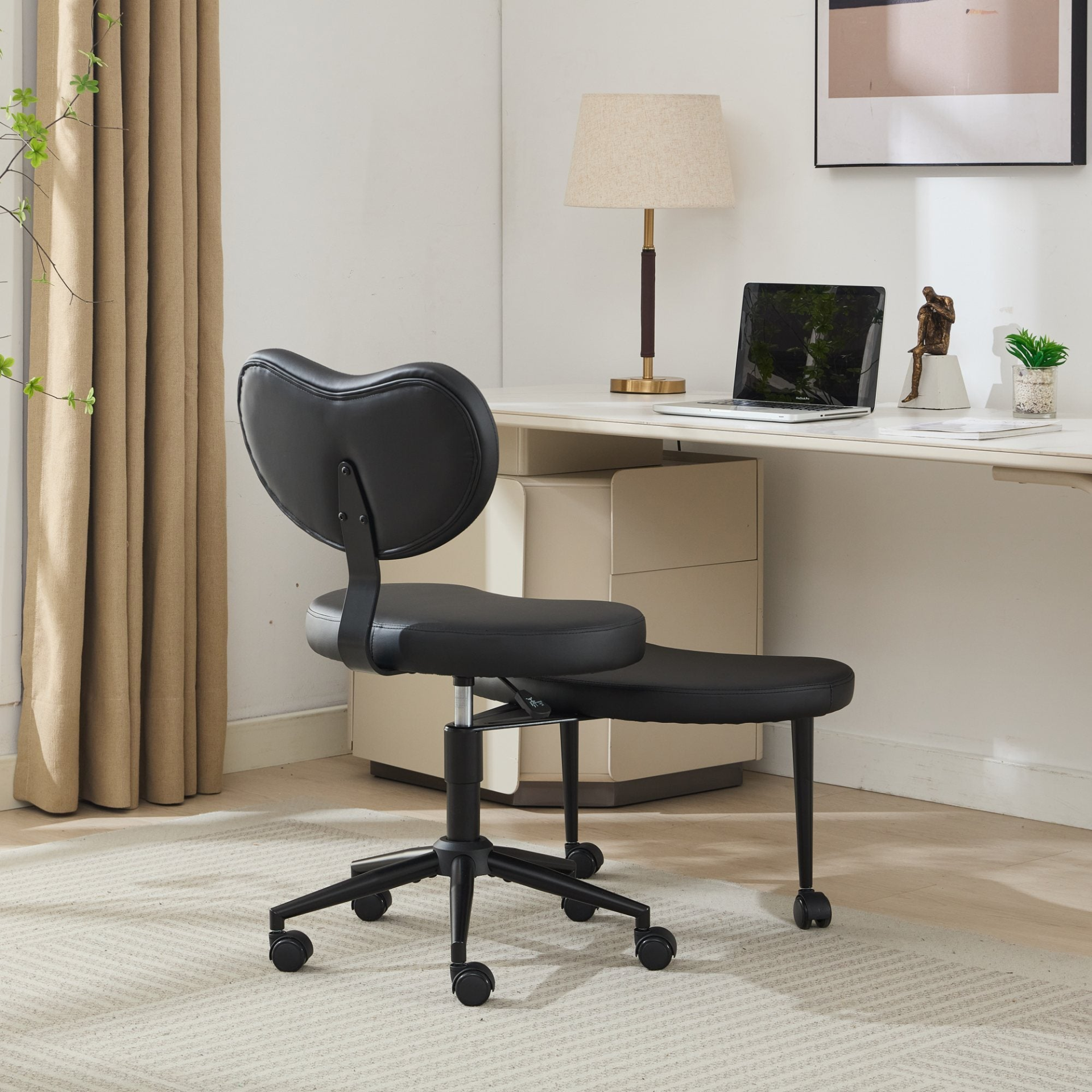 Black PU leather office chair with USB port, swivel base, and ergonomic design for home office or vanity desk by Start2Finish