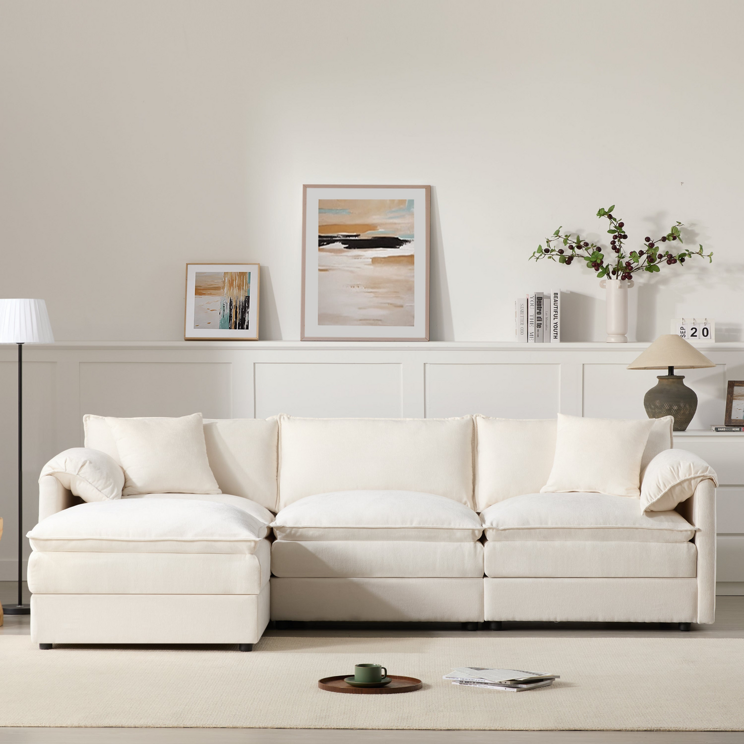 Cream and dark gray chenille sectional sofa with ottoman and modular design for living room and lounge spaces by Start2Finish.