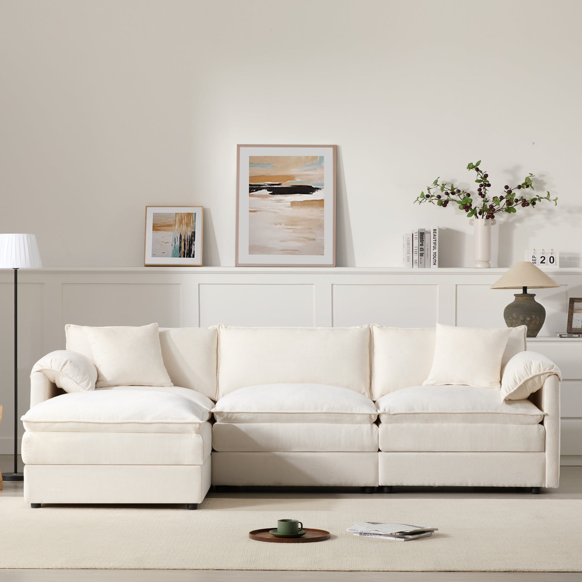 Cream and dark gray chenille sectional sofa with ottoman and modular design for living room and lounge spaces by Start2Finish.