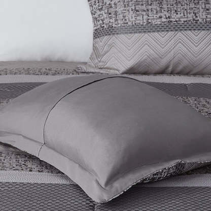 Start2Finish 7-piece Jacquard comforter set with intricate woven pattern and matching pillow shams on a neatly made bed.