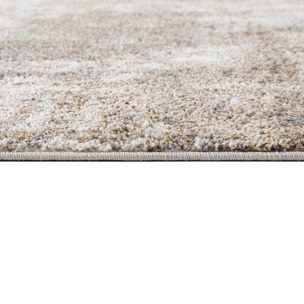 Start2Finish Cozy Shag Abstract Area Rug with plush texture and modern design in neutral tones on a light wooden floor.