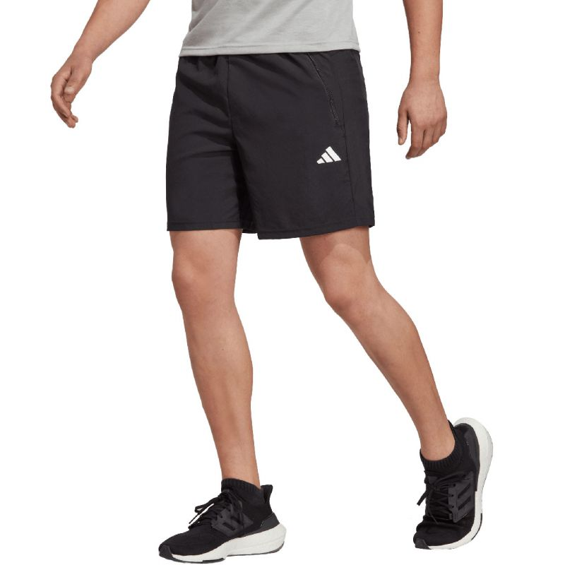adidas Train Essentials Woven Shorts for men, with lightweight fabric and adjustable waistband, shown in black with side pockets