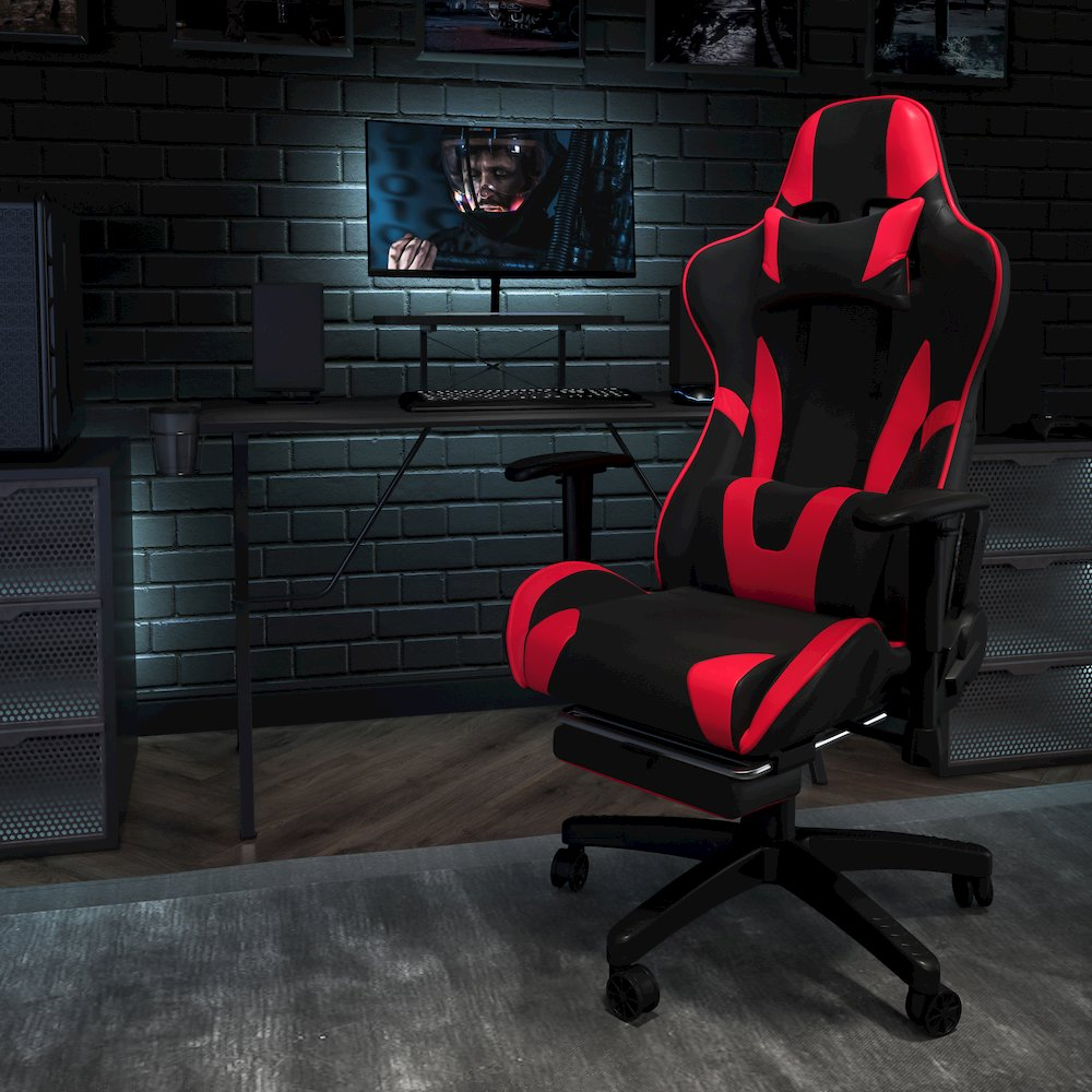 Start2Finish black gaming desk and red/black gaming chair with footrest, ergonomic setup for gaming and office use.