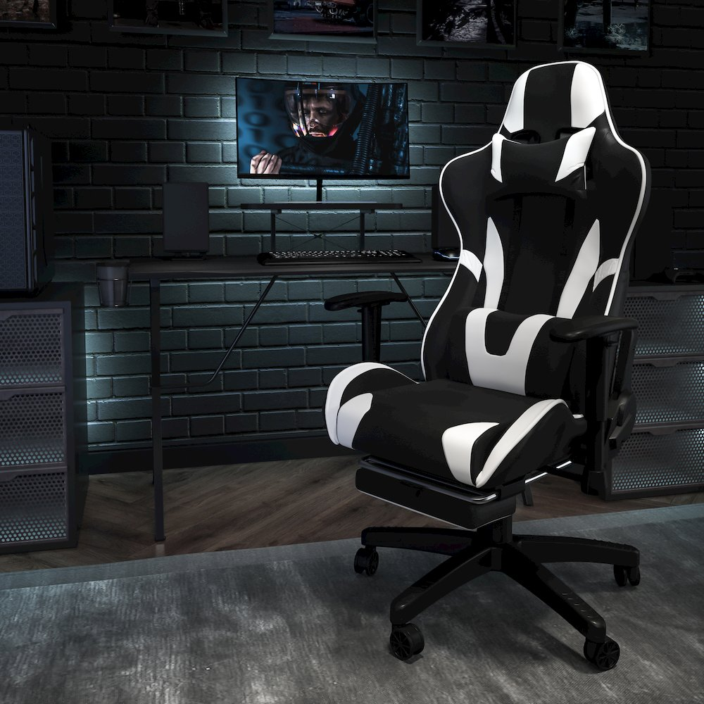 Start2Finish black gaming desk and reclining gaming chair set with footrest, featuring sleek black surfaces and ergonomic design.