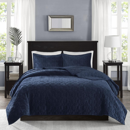 Start2Finish Harper 3-piece velvet quilt set in navy, featuring soft velvet fabric and matching pillow shams on a bed.