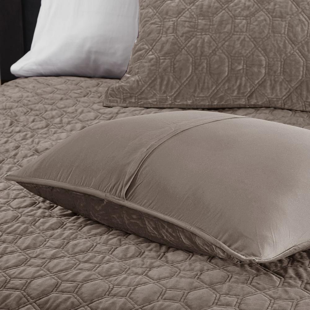 Start2Finish Harper 3-piece velvet quilt set in taupe with matching pillow shams on a bed.