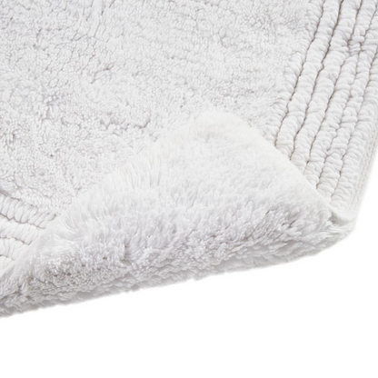 Reversible bath rug made of 100% cotton with 3000 GSM, featuring tufted texture in neutral colors by Start2Finish.