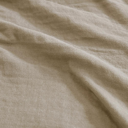 Start2Finish lightweight cotton gauze blanket in tan, showing soft, breathable 100% cotton fabric with a gentle drape.