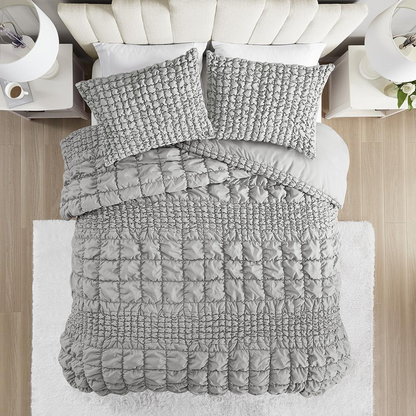 Start2Finish Evelyn 3-piece stripe ruched comforter set in grey on a bed with matching pillow shams.