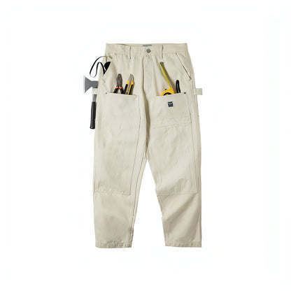 Creamy-white distressed loose jeans for men by Carmine Juneberry, featuring a retro style and relaxed fit.
