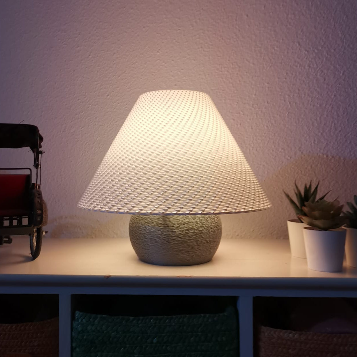 Azure Pontus Aurora Weave portable table lamp with woven design, showcasing its stylish and functional lighting for modern spaces.