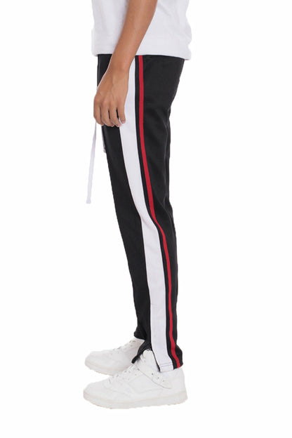 Lime Milo black tricot sweat pants with elastic waistband and relaxed fit, shown on a hanger.