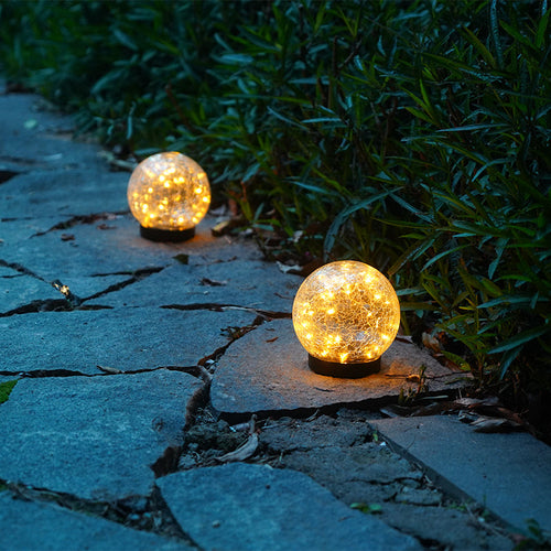 Pink Iolaus outdoor solar crack bottle 20 light waterproof decoration lighting in a garden setting
