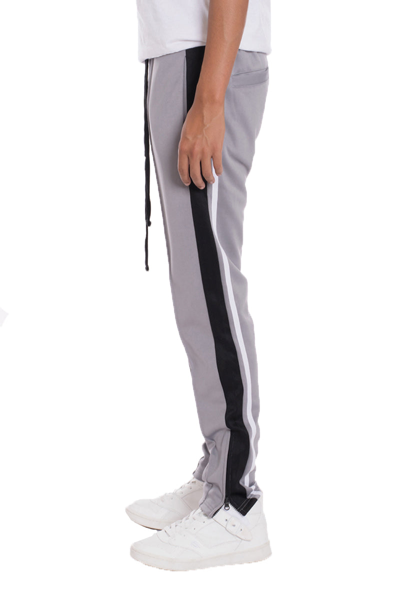 Grey Lime Milo tricot sweat pants shown on a model, featuring a relaxed fit and elastic waistband for casual comfort.