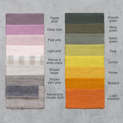 Grey linen curtain with rod pocket from Magenta Sugarplum, showcasing a smooth fabric drape hanging on a curtain rod.