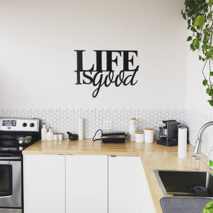 Malachite Life is Good metal wall art displayed in a kitchen setting, showcasing vibrant, decorative home decor with a positive message.