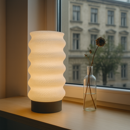 Azure Pontus Lumina Twist portable table lamp with a sleek, modern design, featuring a twisting base and adjustable light shade.