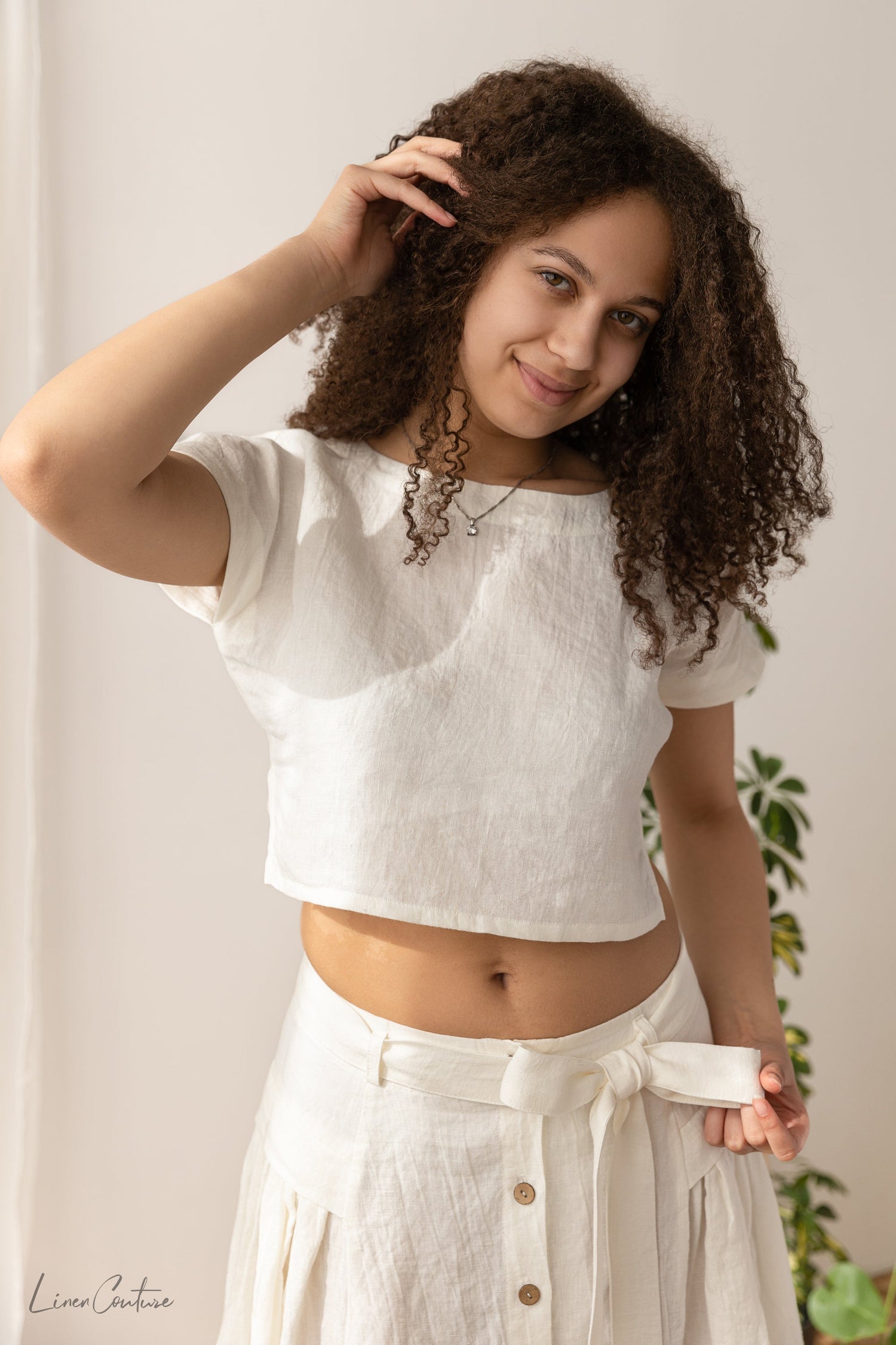 Magenta Sugarplum Taormina linen crop top and flared midi skirt matching set, beige fabric, styled for casual wear.