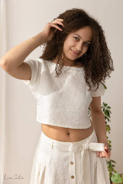 Magenta Sugarplum Taormina linen crop top and flared midi skirt matching set, beige fabric, styled for casual wear.