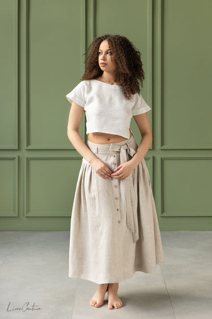 Magenta Sugarplum Taormina Set featuring a linen crop top and flared midi skirt, shown in a stylish matching ensemble.