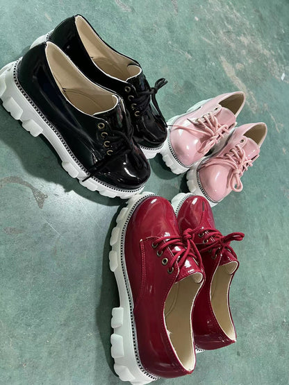 Black, red, and pink thick heel flat platform Oxford shoes for women by Coffee Jasper, featuring a stylish sneaker-inspired design.