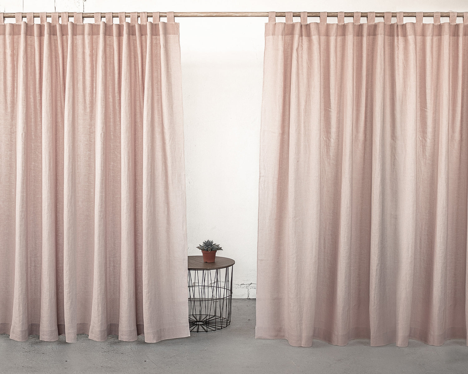 Pale pink linen curtain with tab top design, ideal for home decor, by Magenta Sugarplum.