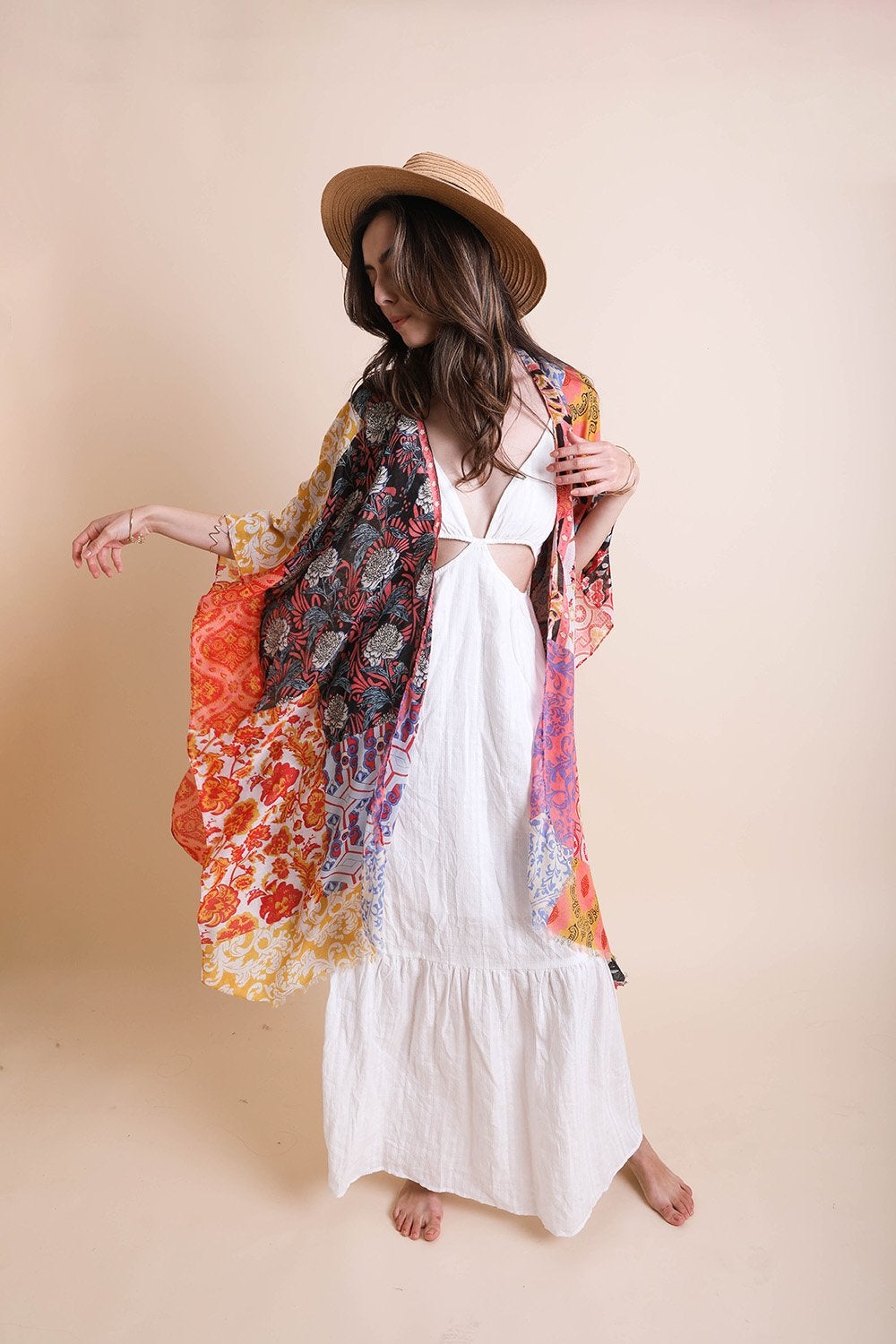 Boho Patchwork Kimono by Periwinkle Aether featuring colorful patchwork fabric, flowing sleeves, and bohemian style accessories.