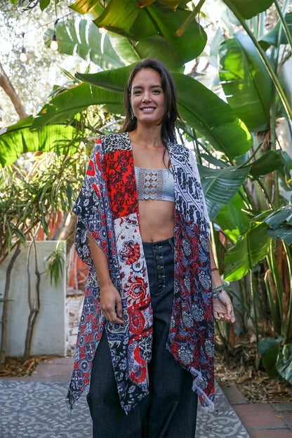 Red boho patchwork kimono by Periwinkle Aether, stylish accessories with colorful patchwork design and flowing fabric.