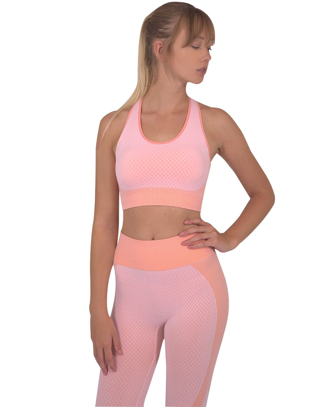 Lazurite Trois Seamless Pink Sports Bra for activewear, shown on a white background with a snug, supportive fit.