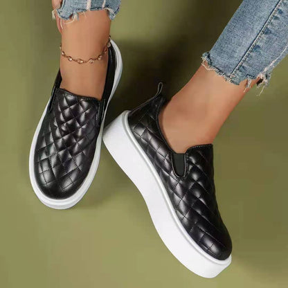 Black and white lightweight slip-on platform loafers by Coffee Jasper, casual flats with a comfortable, stylish design.