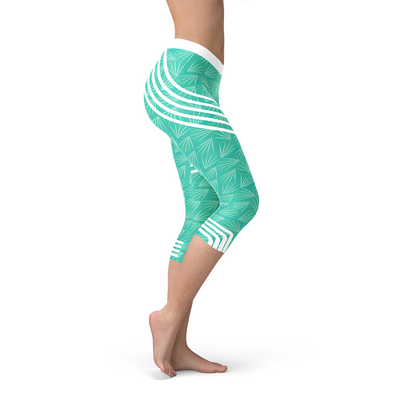 Maroon Sooty turquoise sports capri leggings with a fitted elastic waistband and breathable fabric for active wear.