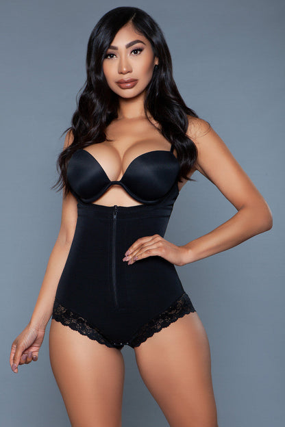 Magenta Caeneus tummy control bodysuit displayed on a mannequin, showcasing the sleek fit and shaping design of the bodysuit.