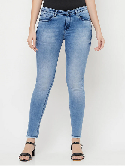 Women’s high rise blue denim jeans by Ochre Ourea, made of cotton, displayed on a model.