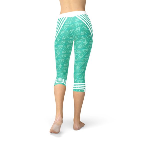 Maroon Sooty turquoise sports capri leggings with elastic waistband and fitted style, suitable for workout and active wear.
