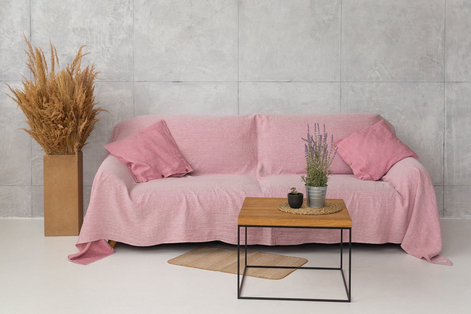 Baby blue linen couch cover by Magenta Sugarplum, showcasing a soft, textured fabric draped over a sofa for home decor.